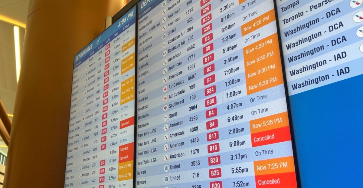 Flight delay board showing delays and cancellations.